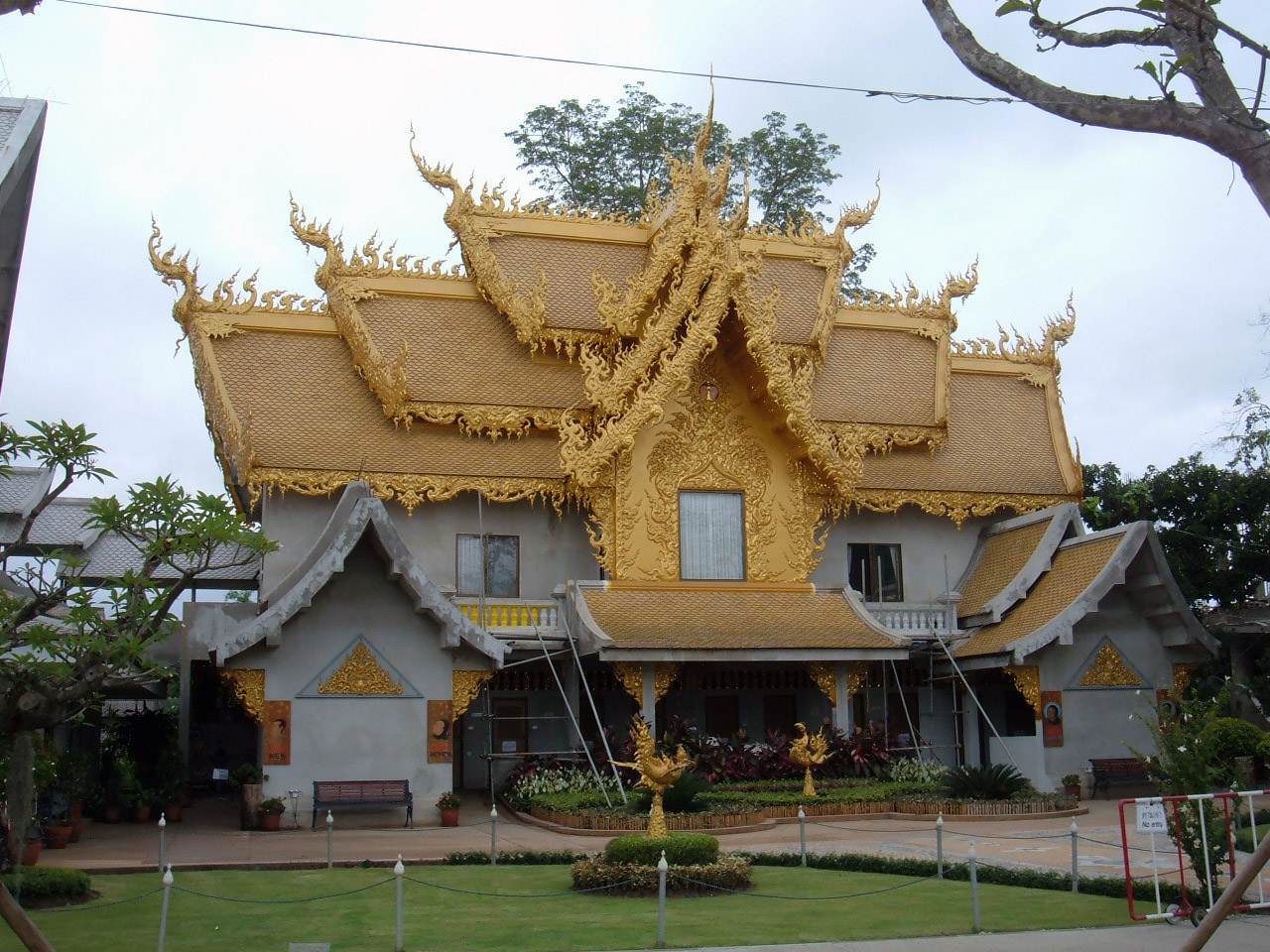 The ornate golden building at Wat Rong Khun, which houses the restrooms